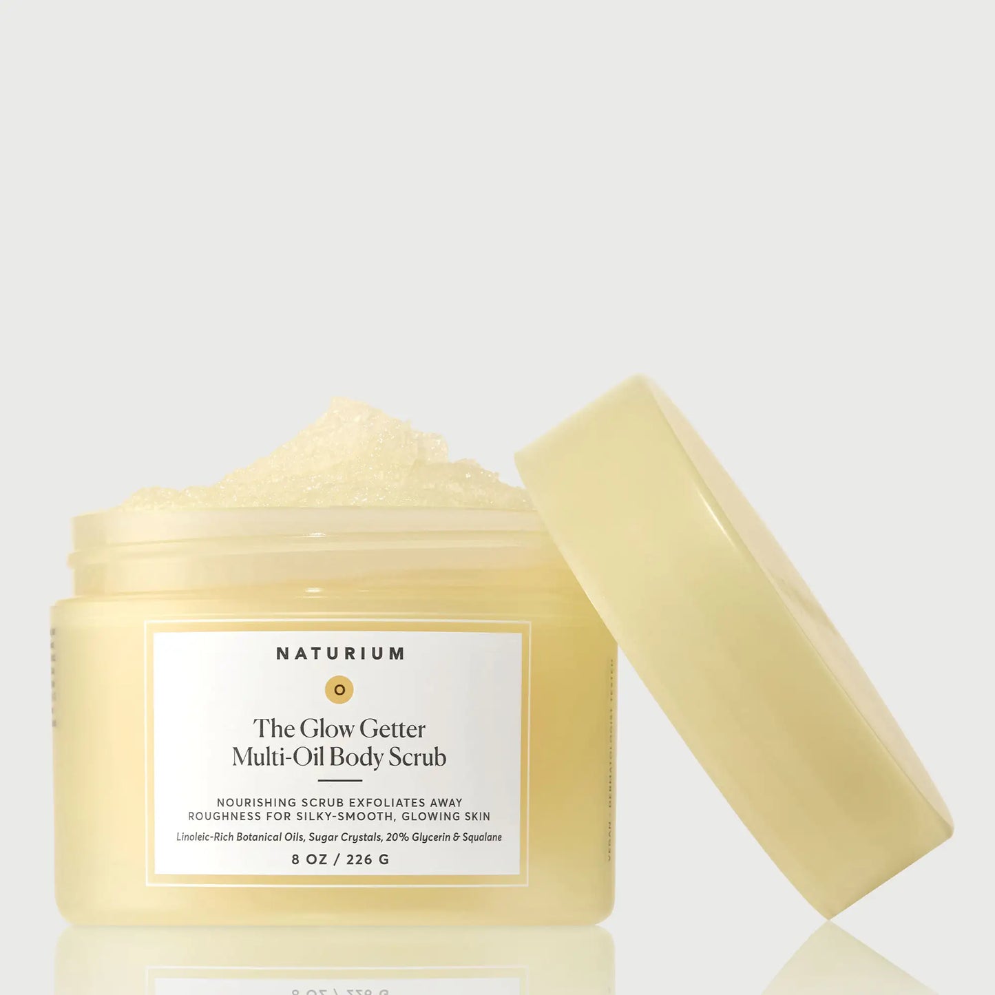 the-glow-getter-multi-oil-body-scrub-j1 NATR-40028-GlowGetter-Multi-Oil-Body-Scrub-Front-CapOff-bonebkgd.webp